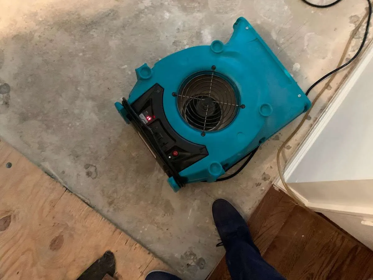 Air mover drying subfloor during Commercial Water Damage Restoration in Hesperia